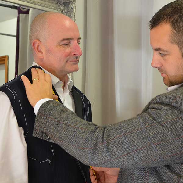 Trying on a bespoke suit